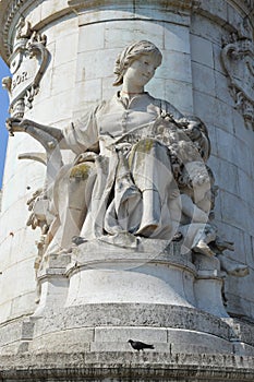 Satue of woman on monument of Liberty in Place de la Republique in Paris photo