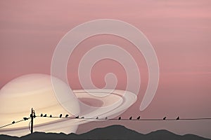 Saturn planet back silhouette birds on power electric line and mountain background