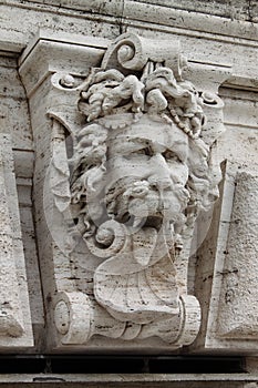 Satyr mask basrelief