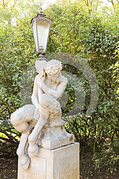 Satyr or Pan holding a lamp in Lazienki Park. Warsaw. Poland. photo