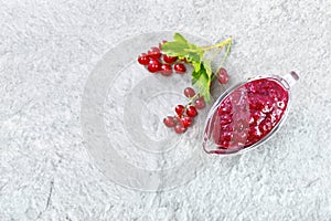 Sauce of redcurrant on stone table top