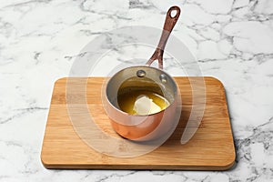 Saucepan with melting butter