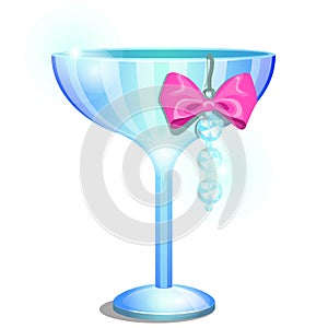 A saucer glass or ramekin of champagne decorated with a pendant or earring with artificial diamonds and pink ribbon bow