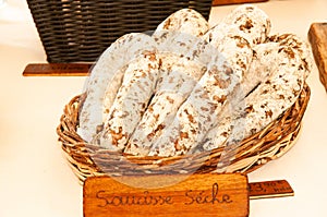 saucisse seche sausage links, in wood wicker basket