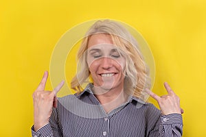 Saucy blonde on a yellow background