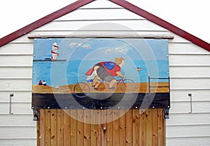 Saucy postcard beach hut painting