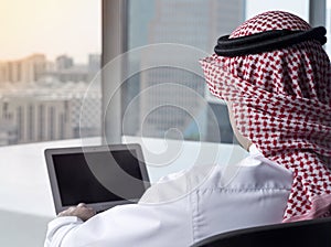 Saudi Arab Man Watching Laptop at Work Contemplating