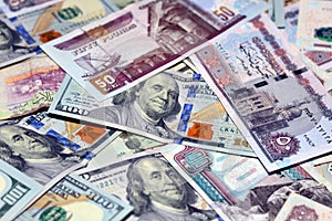 Saudi Arabia currency with USA currency and Egypt currency banknotes. Egyptian pounds, Saudi riyals and American dollars.