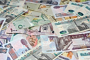 Saudi Arabia riyals and Egyptian pounds background, selective focus of Saudi and Egyptian money