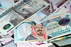 Saudi Arabia riyals and Egyptian pounds background, selective focus of Saudi and Egyptian money