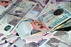 Saudi Arabia riyals and Egyptian pounds background, selective focus of Saudi and Egyptian money