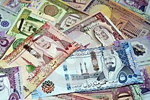 Saudi Arabia riyals money banknotes collection of different times and values feature portraits of Al Saud kings of Saudi Arabia,