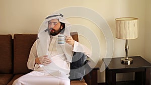 Saudi arabian man drink coffee at home