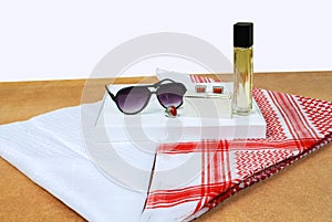 Saudi Arabian men wearing style accessories red white headscarf shemagh sunglasses perfume stone ring cufflinks decorated on