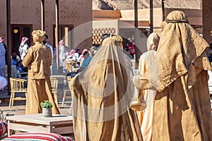 Saudi arabians dressed in golden ritual clothes in ceremony of the camel cup race performance, Al Ula, Saudi Arabia