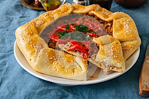 Saudi aysh abu laham or Saudi pizza or meat galette, traditional