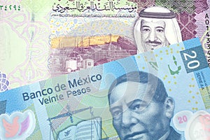 A Saudi five riyal bank note with a twenty Mexican peso bank note