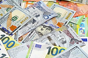 Saudi riyals money with American dollars bills and European euros banknotes, a pile of 200 and 500 Saudi Arabia riyals