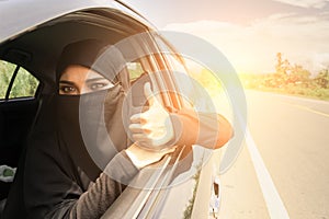 Saudi Woman Driving a Car on the road.