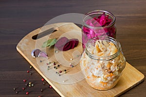 Sauerkraut with beets and spices in a glass jar