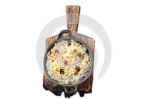Sauerkraut in a skillet with black pepper and cranberry, Fermented cabbage. Isolated, white background.