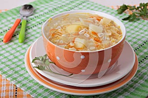Sauerkraut soup with pearl barley and potatoes