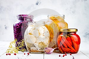 Sauerkraut variety preserving jars. Homemade red cabbage beetroot kraut, turmeric yellow kraut, marinated cauliflower, red chili