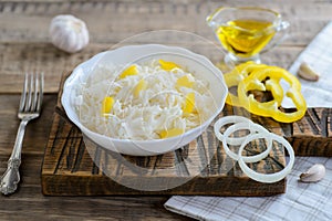 Sauerkraut in a white bowl, traditional russian cuisine