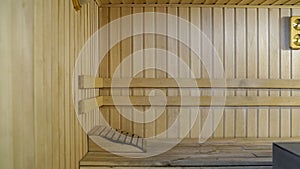 Sauna accessories are in the interior of the steam room. The interior of the sauna. Sauna from linden