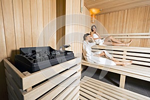 Sauna heater and girls relaxing