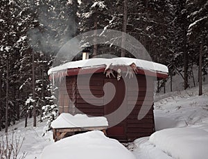Sauna hut in winter forest