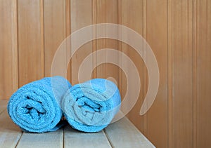 Sauna interior with green towels