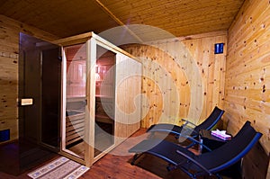 Sauna interior with two sunbeds and cherry wood walls