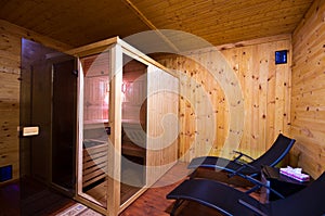 Sauna interior with two sunbeds and cherry wood walls