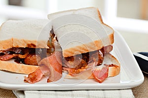 Sausage and bacon sandwich