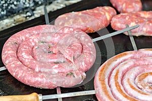 The sausage browned on the barbecue photo