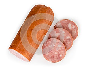 Sausage cut into pieces on a white. The view from the top.