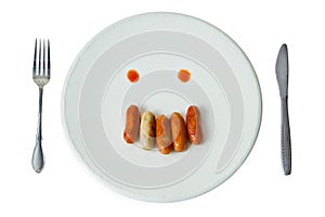 Sausage face on white dish