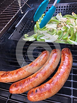 Sausage, Green Peppers and Onions Cooking on the Grill