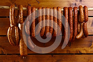 Sausage hanged on wooden background