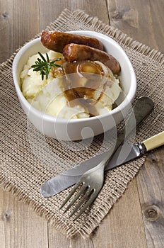 Sausage and mashed potato with onion gravy