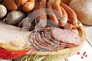 Sausage and meat assortment on cutting board