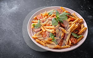 Sausage penne Pasta with tomato sauce and fresh herbs