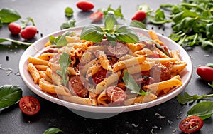 Sausage penne Pasta with tomato sauce and fresh herbs