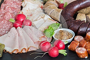 Sausage plate variation on a wooden table