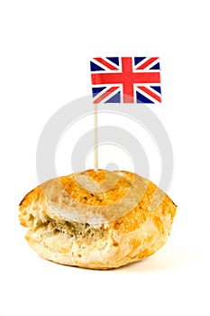 Sausage roll with union jack over white