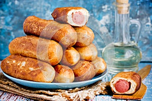 Sausage rolls, pastry wrapped sausages, fried sausages in blankets, sausage pies in dough