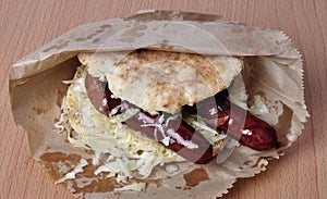 Sausage sandwich. A traditional Serbian sausage sandwich in a bun