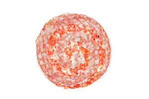 Sausage Slice of salami isolated on a white. Top view.