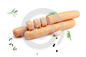 Sausage on white background with herbs and peppercorns